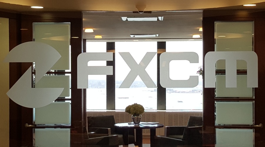An FXCM logo in an office space