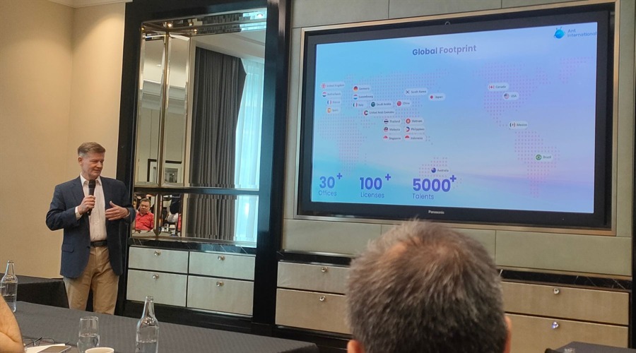 Ant International's President, Douglas Feagin, showing the payment capabilities in a media briefing