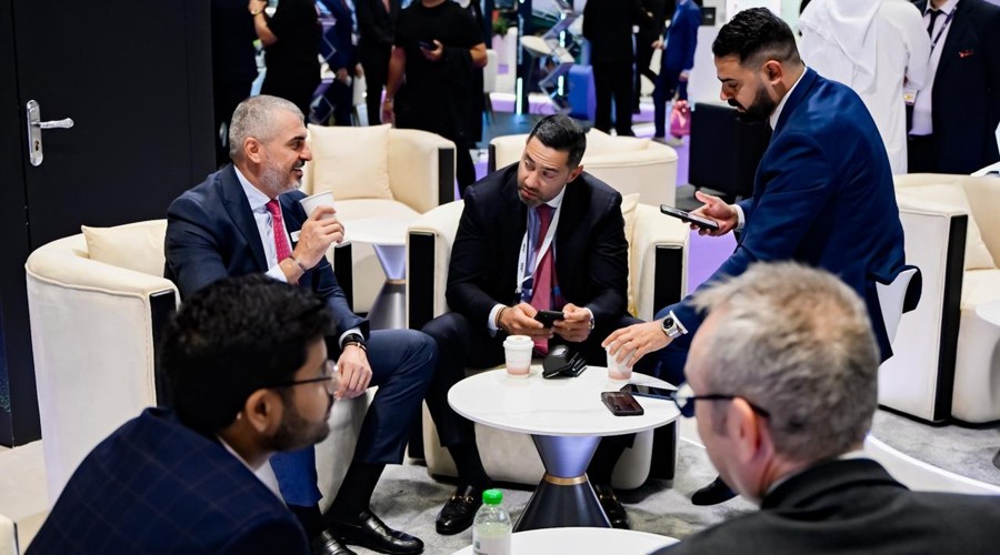 Attendees networking at iFX EXPO Dubai