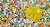 Make Money Online Graphic shows a gold Bitcoin coin laying on the background full of colorfull stones