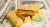 Gold trading concept: small gold bars lying on US dollar bills
