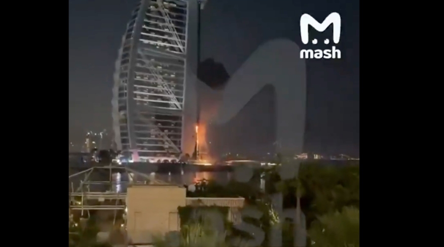 Burj Al Arab with flames nearby after a reported Iranian strike, Source: Mash