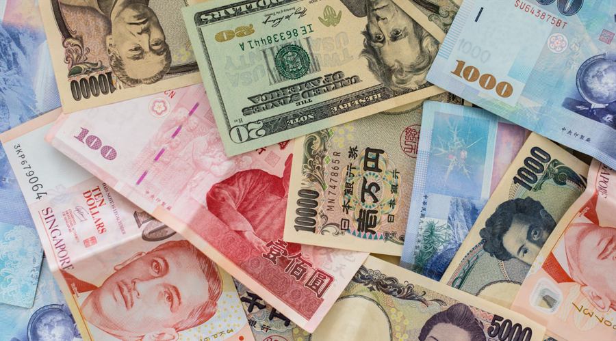 Different International money banknotes bills stacked background