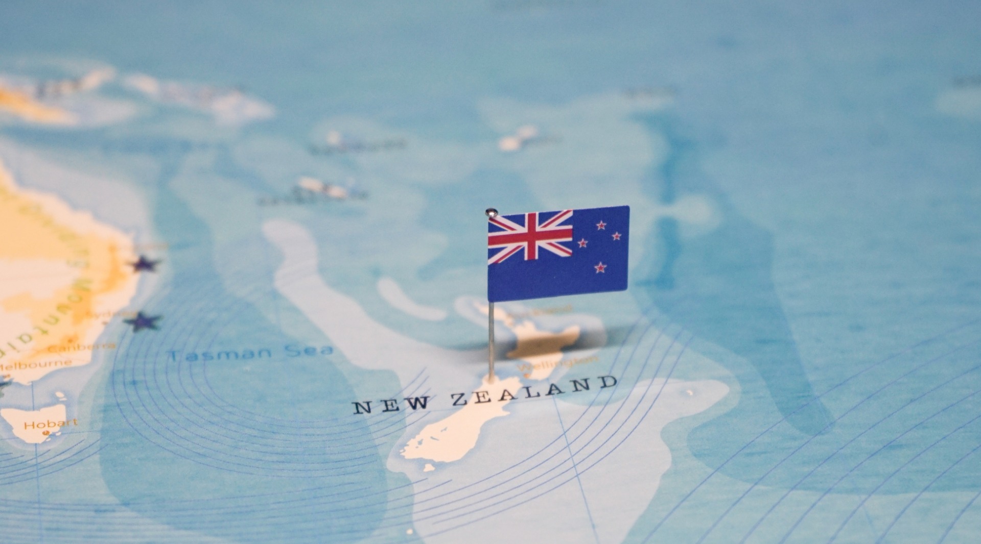 Map and a flag of New Zealand