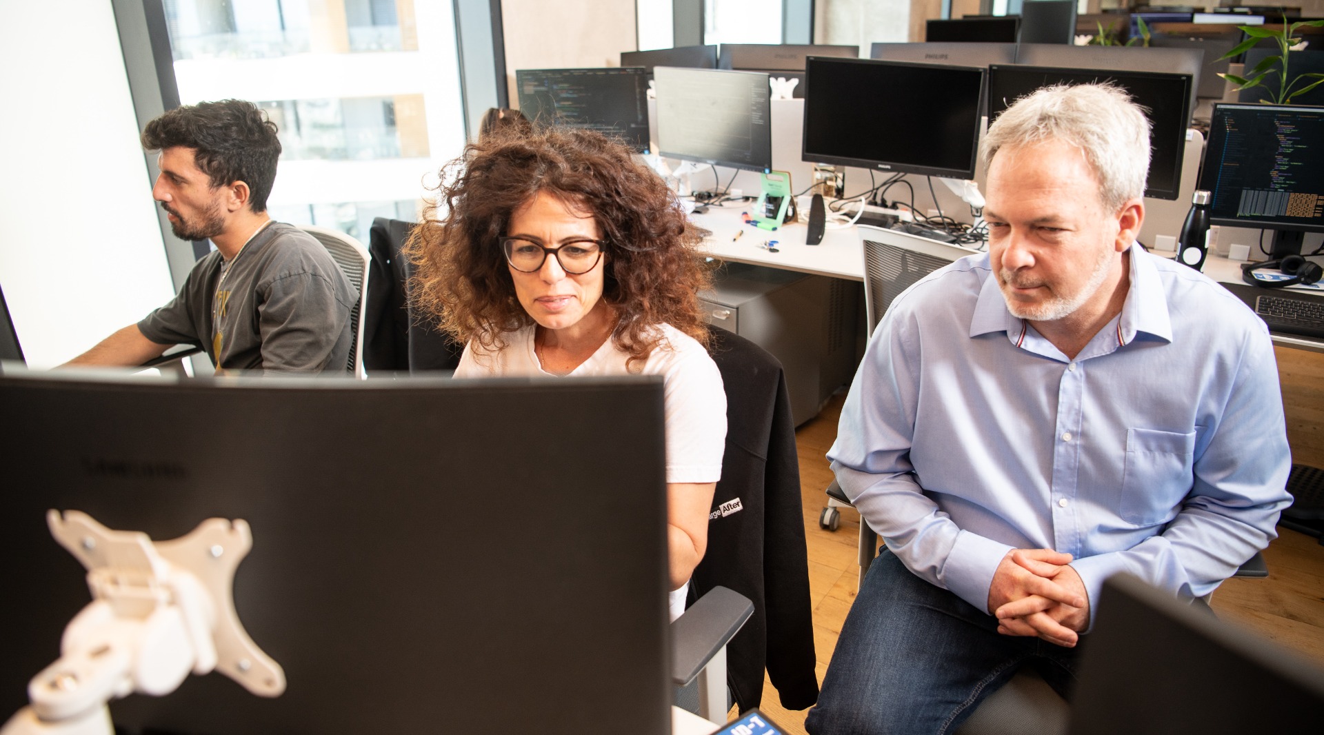 Meidad Sharon (right) at the ChargeAfter office in Tel-Aviv