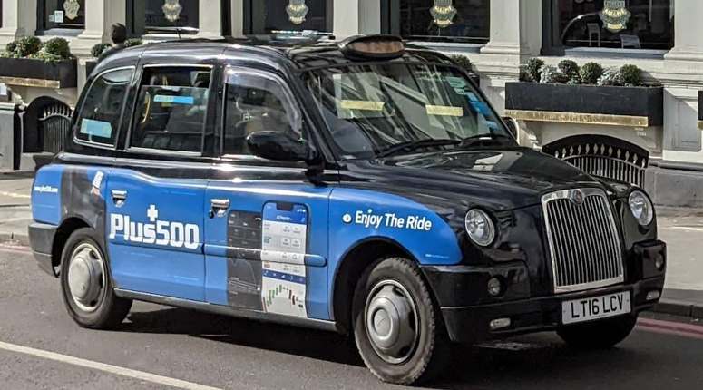 Plus500 logo on a London taxi