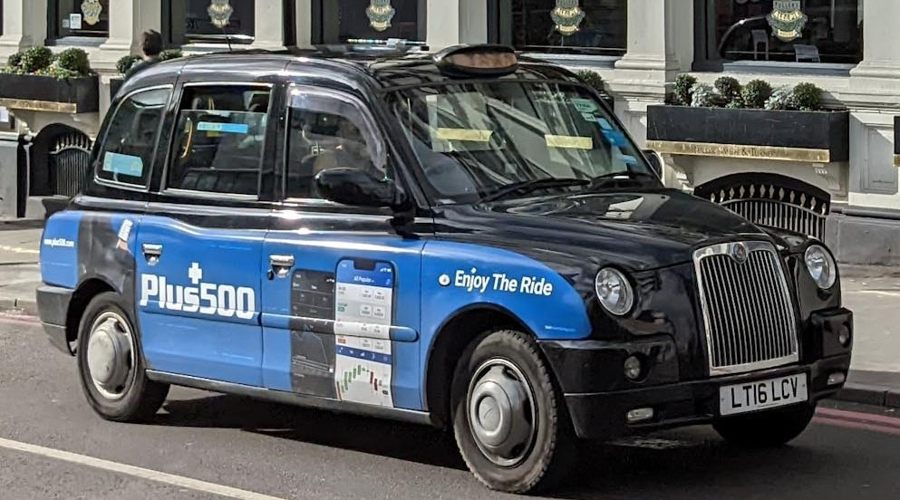 Plus500 logo on a London taxi