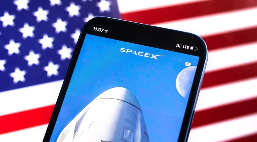 SpaceX logo against American flag, USA background