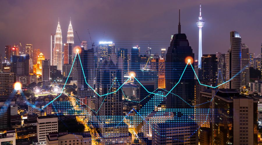 Stock market graph hologram, night panorama city view of Kuala Lumpur