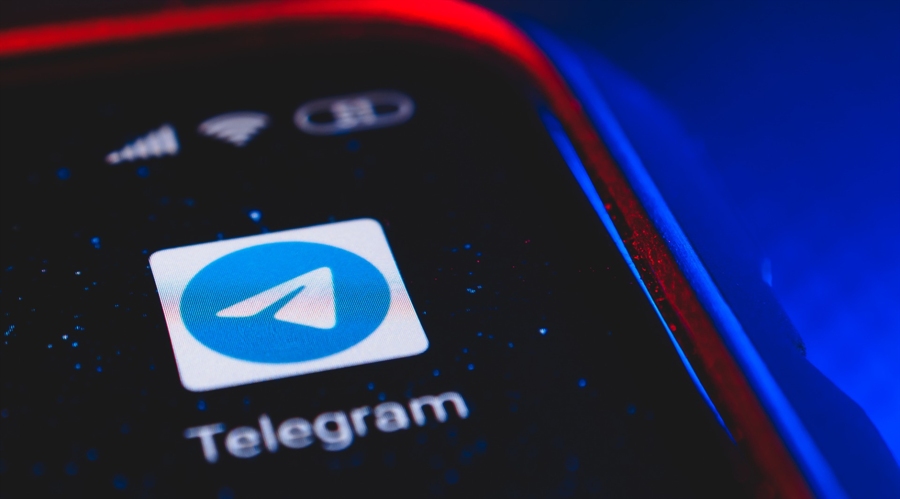 Telegram logo on a phone (Shutterstock)