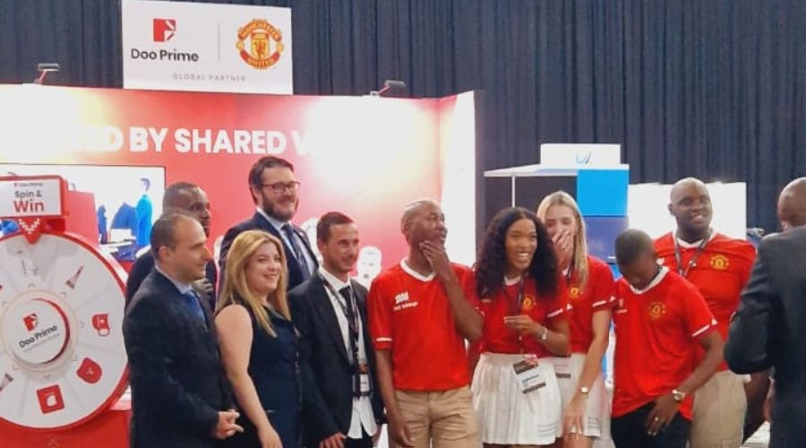 The Doo Prime team in front of their booth