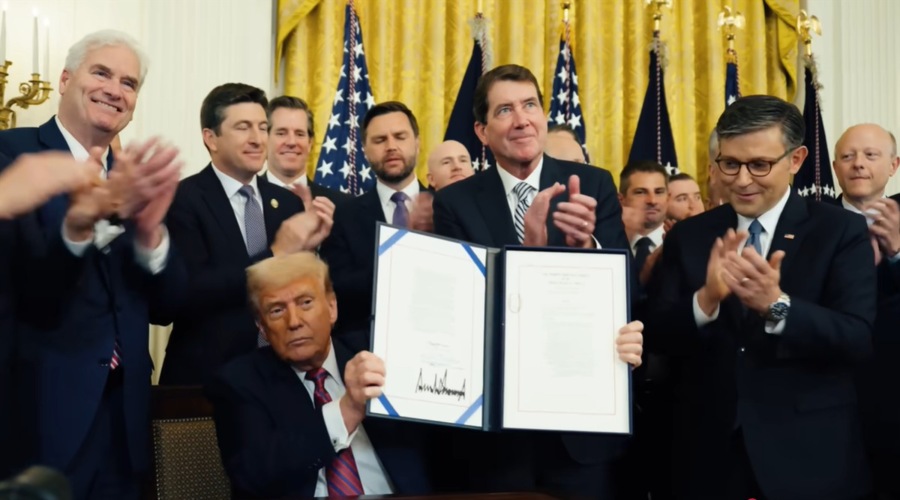 US President Donald Trump signing the GENIUS Act