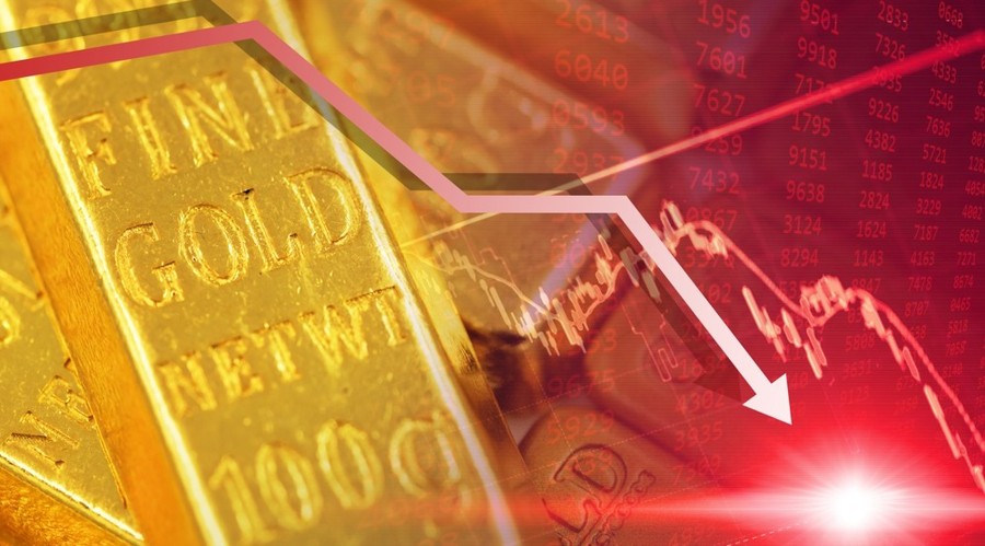 A gold bar with the red chart downward line showing gold price falls
