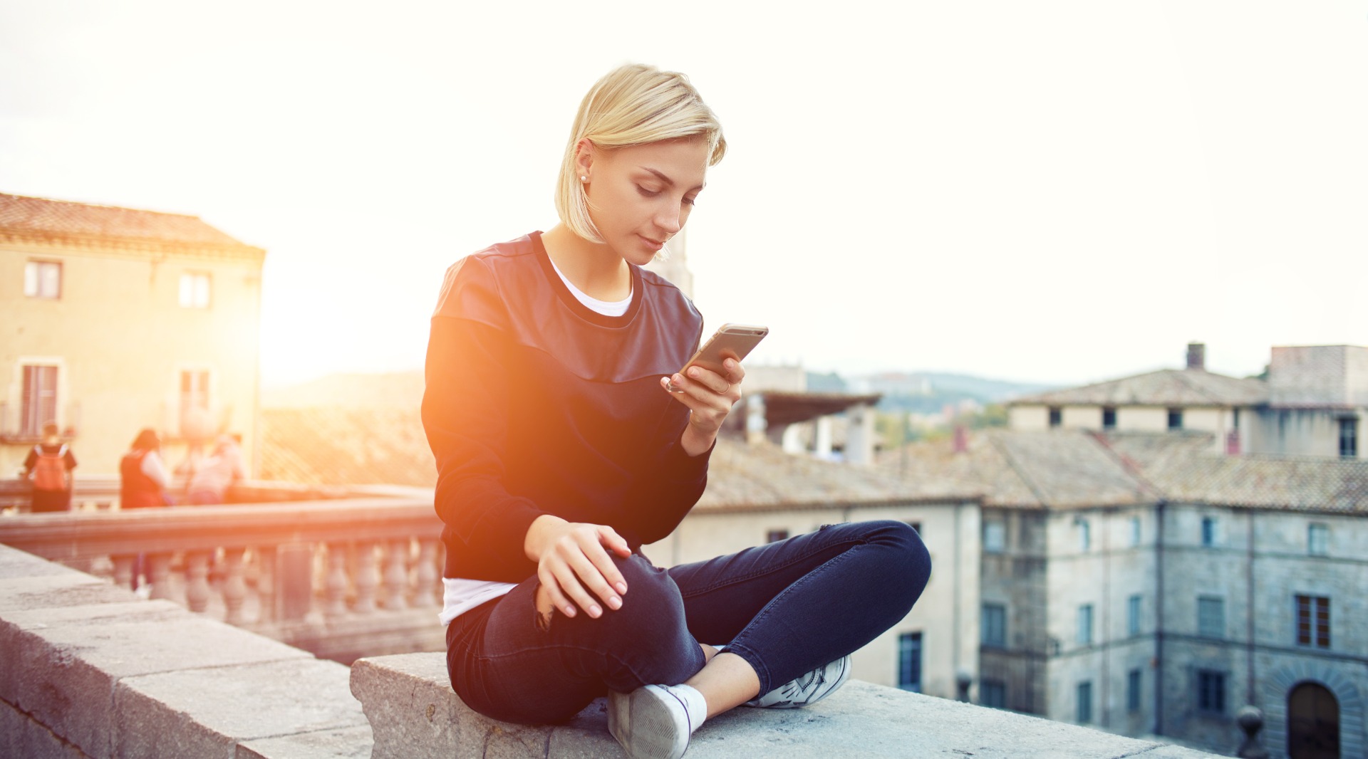young people using phone (shutterstock)